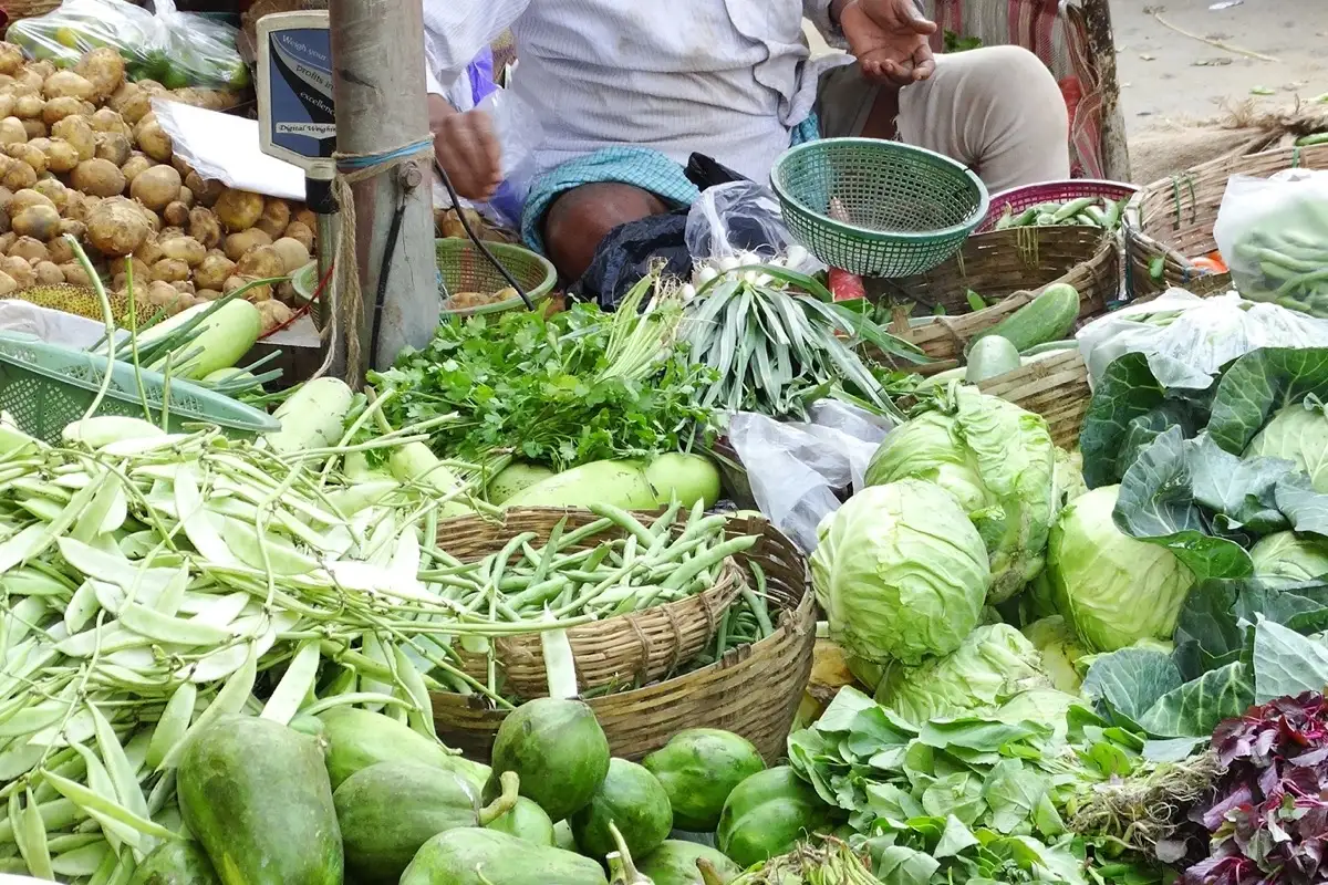 A vegetable vendor with produce on College Street, Kolkata